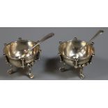 Pair of Victorian circular silver salts with decorative feet. London hallmarks, makers initials H.H.