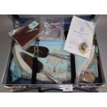 Suitcase comprising masonic regalia, to include aprons, medals/jewels, silver miniature bible,