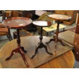 Three similar reproduction mahogany pedestal wine tables. (3) (B.P. 21% + VAT)