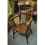 20th Century stained beech and elm stick back fireside elbow chair on baluster turned legs. (B.P.