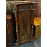 19th Century continental oak pedestal with overall carved decoration, single frieze drawer above