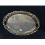 Silver plated two handled serving tray of oval form with pierced foliate decoration. (B.P. 21% +