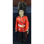 Mannequin of a young boy dressed as a guardsman. Height (including hat) 127cm approx. (B.P. 21% +