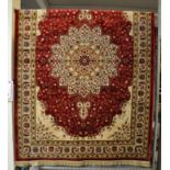 Red ground Kashmir floral pattern rug, full pile. 240 x 160cm approx. (B.P. 21% + VAT)