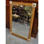 20th Century gilt framed pier glass with simulated porcelain mounts and bevel plate. 62cm wide