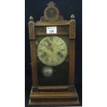 Early 20th Century German two train mahogany cased clock with chip carved architectural design