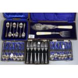 Three cased sets of six silver teaspoons, together with a cased set of six fish or pickle forks