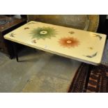 Mid Century retro coffee table decorated with butterflies and foliage on tapering ebonised legs. (