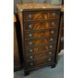 Regency style reproduction mahogany tall music filing cabinet with fall front drawers on bracket