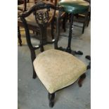 Edwardian stained low lyre backed nursing chair on cabriole front legs with stuff over upholstered