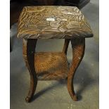 Foliate carved low occasional table on four outswept legs with under tier. 34cm wide approx. (B.P.