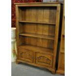 Reproduction oak open bookcase with two adjustable shelves and two ogee pointed arch panelled