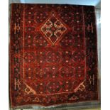 Hand woven red ground Persian Hamadan village rug. 245 x 150cm approx. (B.P. 21% + VAT)