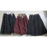 Three 19th Century traditional Welsh costume woollen petticoat skirts, one with a black and red