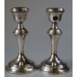 Pair of mid Century silver candlesticks with loaded bases by Broadway & Co, Birmingham 1965. (B.P.