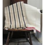 Two antique narrow loom Welsh woollen blankets; one with a narrow alternating black and light