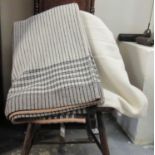 Two antique narrow loom Welsh woollen blankets; one with a narrow black stripe with dark brown and