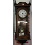Early 20th Century walnut single train Vienna type wall clock with key and pendulum. (B.P. 21% +