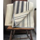 Two antique narrow loom Welsh woollen blankets; one with black stripes of different width and the
