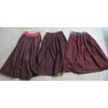 Three 19th Century Welsh traditional costume woollen red and black striped petticoat skirts, two