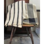 Two antique narrow loom Welsh woollen blankets; one with a wide black stripe with a more modern 'The