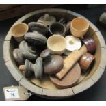 Small wooden coopered bowl with metal banding containing various treen items including; butter pats,