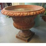 Large 19th Century terracotta campana shaped garden urn with relief foliate and leaf decoration,