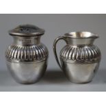 Silver cream jug of baluster form with fluted body, together with a matching sugar sifter or shaker.