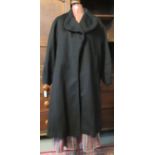 Early 20th Century black coat with astrakhan edged collar and balloon sleeves with scalloped detail,