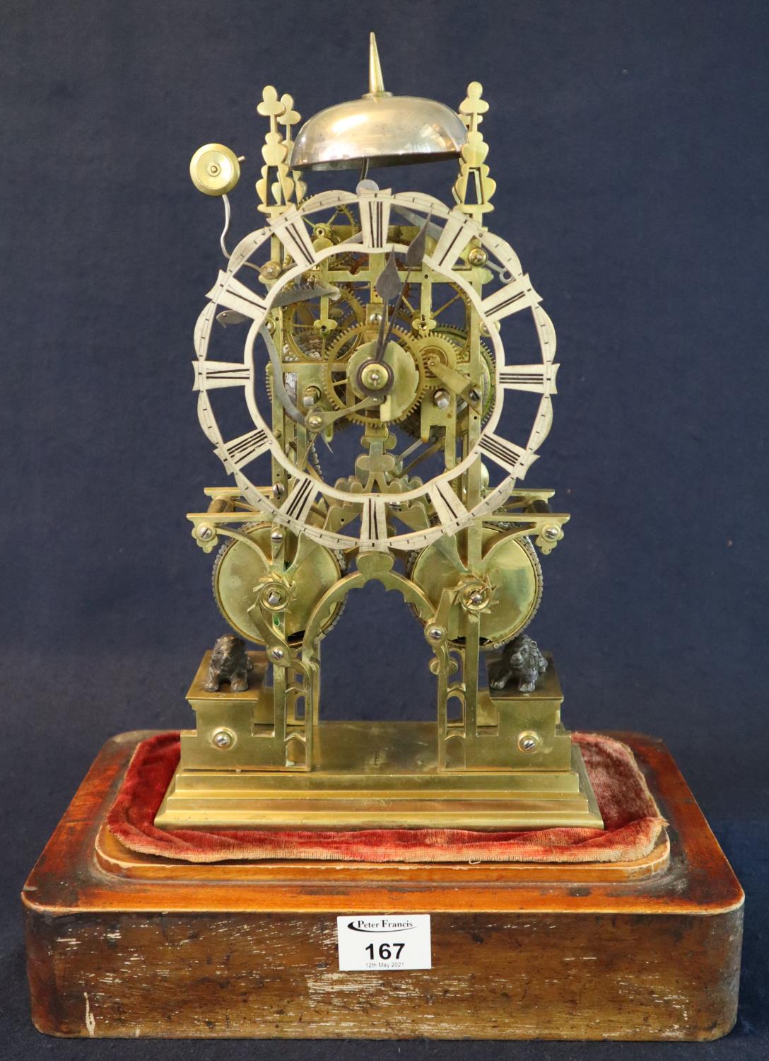 19th Century brass skeleton clock having single bell with four steeples, pierced and silvered