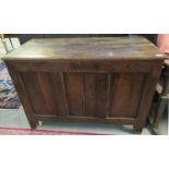 18th Century oak coffer of plain form having three moulded panels, standing on stile feet, the