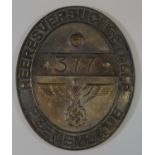 Cast metal German Second World War design wall plate marked 'Heeres Versuchs Stelle', no. 377 with