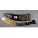 Nepalese Kukri with wooden grip and repousse pierced silvered metal mounts to the velvet covered