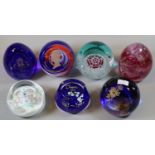 Collection of seven Caithness and other paperweights, to include commemorative Vivat Regina, etc. (