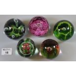 Collection of paperweights to include Caithness 'Moonflower', 'Maydance', and others. (5) (B.P.