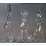 Three glass decanters and stoppers of mallet-shaped and ships type form. (3) (B.P. 21% + VAT)