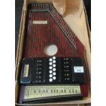 Autoharp with 32 strings in original box. (B.P. 21% + VAT)