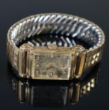 Bulova 18ct gold plated gents tank style rectangular watch with gem set face and expanding bracelet.