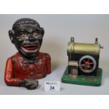 Cast iron black man money box, together with a tin plate 'Model Junior' steam engine. (2) (B.P.