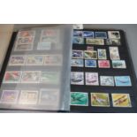 All world collection of space stamps in blue stock book. About 300 stamps. Mostly used. (B.P.