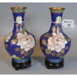 A pair of modern Chinese cloisonne vases of baluster form decorated with flowers and foliage on