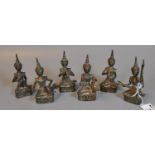 A group of six Thai yellow metal musical seated figurines. (6) (B.P. 21% + VAT)