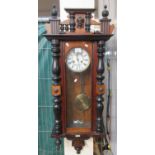 Early 20th Century two train Vienna type wall clock with key and pendulum, plaque for A.W. Lucas,