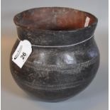 A burnished clay pot with incised banded decoration, possibly of African origin. (B.P. 21% + VAT)