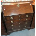 19th Century mahogany fall front bureau with fitted interior above a bank of four drawers on bracket