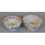 Two similar 18th Century porcelain tea bowls with hand painted enamelled flowers, possibly New Hall.