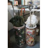 Two oriental design ceramic stick stands containing various vintage umbrellas and a metal shooting