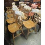 A set of eight beech spindle back kitchen chairs (6+2) (8)