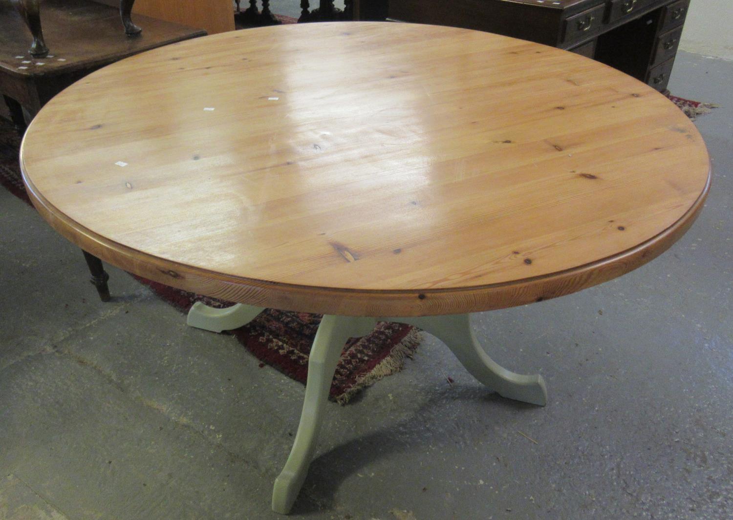 Modern pine centre or dining table on painted quatreform base. (B.P. 21% + VAT)