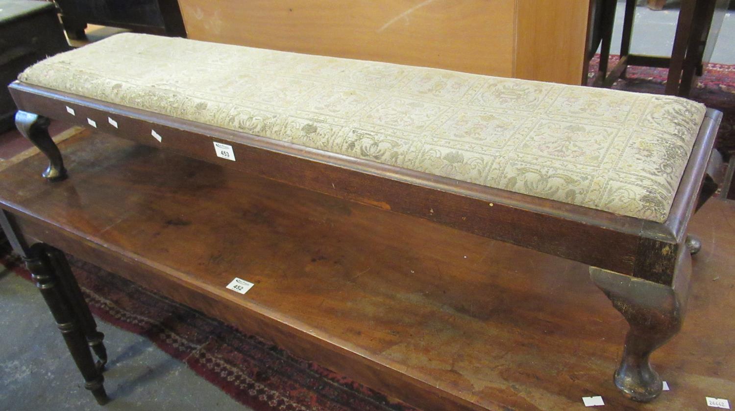 Early 20th Century oak framed footstool of narrow and low proportions on cabriole legs. (B.P.